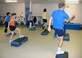 Fitness enthusiasts participate in an aerobic StrongStep class in Jacki Sorensen's Fitness Classes.